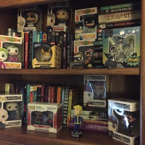This is my tiny bookshelf, I had already informed my husband that I need a bigger one since all my funkos and my books don't fit on these two tiny little shelves. He didn't say no but that is because I control the checking account. ;) 